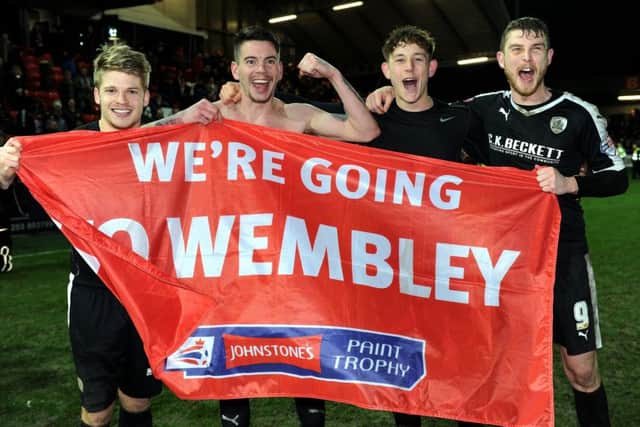 Barnsley's players celebrate after sealing their date at Wembley.