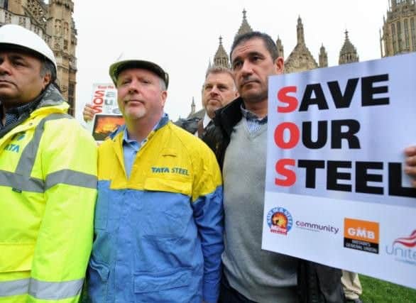Members of the Unite union and Tata Steel workers gather in Parliament Square, London, in Autumn 2015 ahead of a protest calling on the government to help save the UK steel industry.