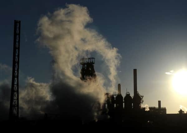 The sun sets behind the Tata steel works in Port Talbot, Wales, as the steel giant confirmed plans to sell its UK assets, threatening thousands of job cuts.