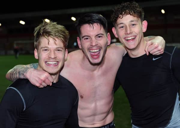 WE'RE GOING TO WEMBLEY: Lloyd Isgrove, Adam Hamill and Josh Brownhill celebrate their semi-final win over Fleetwood Town. 
Picture: Jonathan Gawthorpe