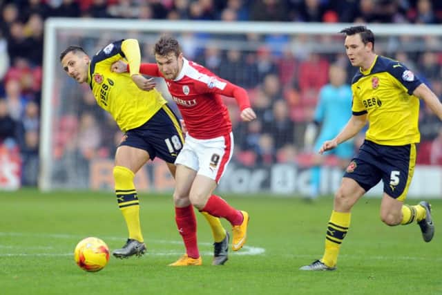 Barnsley's Sam Winnall battles with Fleetwood Town's Antoni Sarcevic and Eggert Jonsson in the semi-final first leg back in January. Picture: Tony Johnson