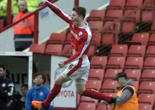 Barnsley's Alfie Mawson celebrates after scoring the opening goal of the match against Rochdale in January. Picture: James Hardisty.