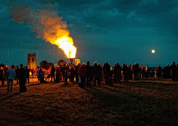 Villagers gather around the beacon in Haxey, which was lit as part of the Diamond Jubilee celebrations in 2012. Picture: Phil Waring