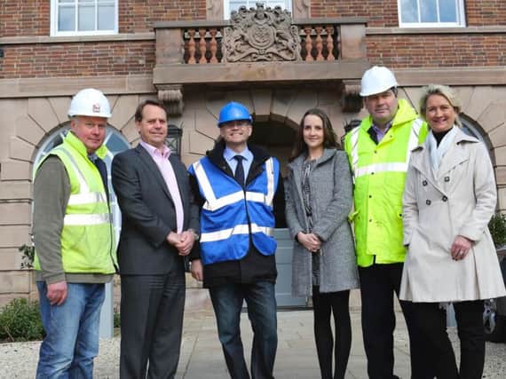 Kevin Kear, Site Manager, GEM Construction, Tony Wright, Carter Jonas, Julian Rooney, Partner, Harrogate Restoration LLP, Katie Weldon, Carter Jonas, Mike Green, Chairman, GEM Construction, Anne Haggas, Northern New Homes Manager, Carter Jonas outside the iconic old police station building.