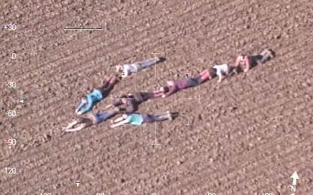 A group of youngsters who formed a human arrow in Capel, Surrey, to point a police helicopter in the direction of two suspected burglars on the run.