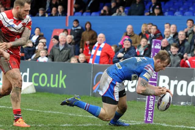 Wakefield Trinity Wildcats' Wakefield's Tom Johnstone scores his first try against Salford Red Devils.
 Picture: Jonathan Gawthorpe