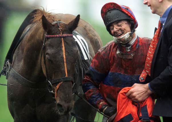 Richard Guest shows his delight after he had riden Red Marauder to win the 2001 Grand National.