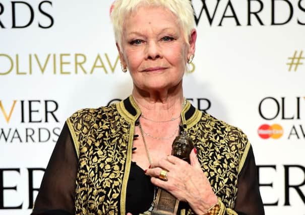 Dame Judi Dench with the award for Best Actress in a Supporting Role, for The Winter's Tale, at The Royal Opera House in Covent Garden, London.