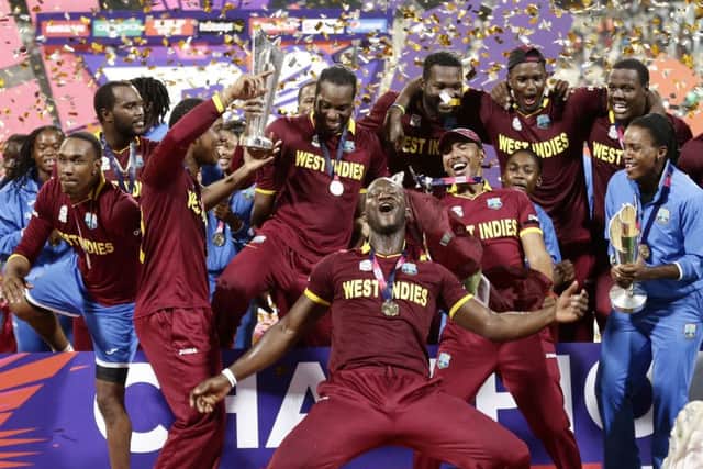 West Indies men's and women's players celebrate after their respective wins in the finals of the ICC World Twenty20 2016 cricket tournament at Eden Gardens in Kolkata. (AP Photo/Saurabh Das)