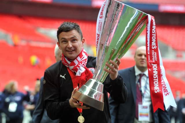 I'M IN CHARGE: Barnsley's Paul Heckingbottom with the Johnstone's Paint Tophy. Picture:Tony Johnson