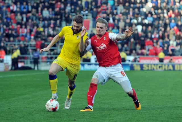 Leeds United's Mirco Antenucci tussles with Rotherham's Danny Ward at the New York Stadium. Picture: Tony Johnson