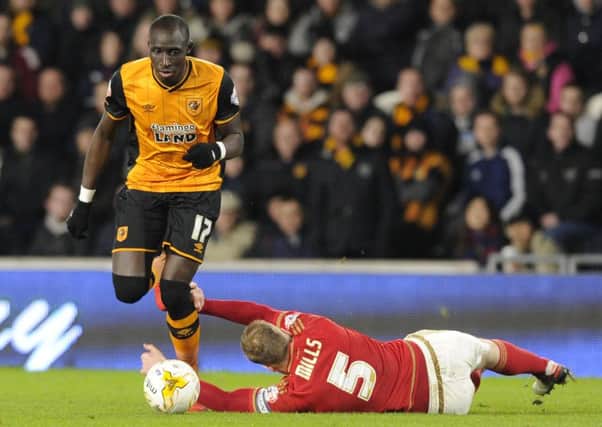 Matt Mills grabs Mo Diame's legs in a desperate attempt to stop his attack during last month's clash between Hull and Nottingham Forest. (Picture: Bruce Rollinson)
