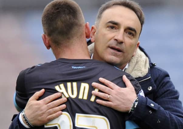 Carlos Carvalhal embraces Jack Hunt after Sheffield Wednesdays late win at Huddersfield Town on Saturday (Picture: Steve Ellis).