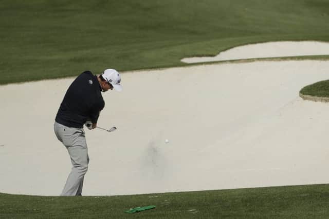 Australia's Adam Scott hits out of a bunker on the driving range during practice for the Masters (Picture: Chris Carlson/AP).
