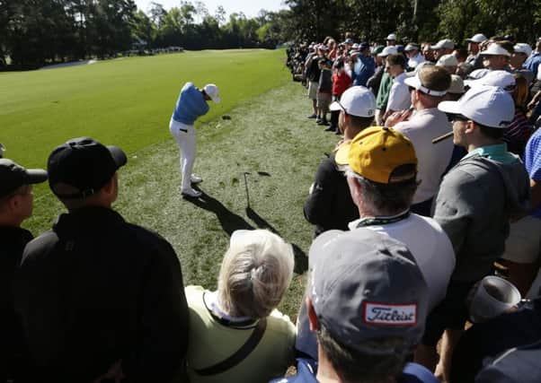 Rory McIlroy hits out of the rough on the fifth hole during a practice round for the Masters (Picture: Charlie Riedel/AP).