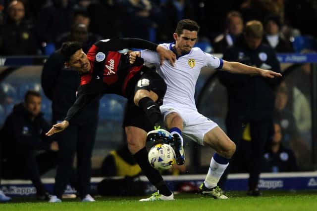 Leeds United's Lewis Cook battles with Queen's Park Rangers' Alejandro Faurlin. 
Picture: Jonathan Gawthorpe