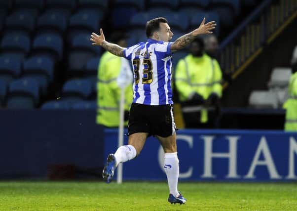 ON TARGET: Ross Wallace celebrates scoring Sheffield Wednesday's second goal. Picture: Steve Ellis.