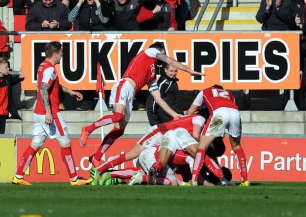 Rotherham United's players celebrate Greg Halford late, match-wining penalty. Picture: Tony Johnson.