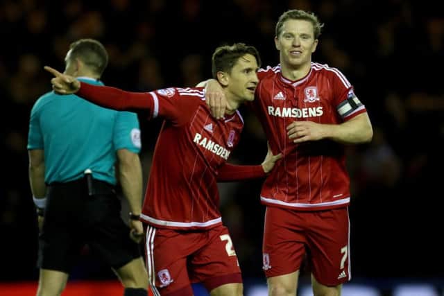 Middlesbrough's Gaston Ramirez (left) celebrates scoring his side's third goal of the game against Huddersfield Town on Tuesdau night. Picture: PA.
