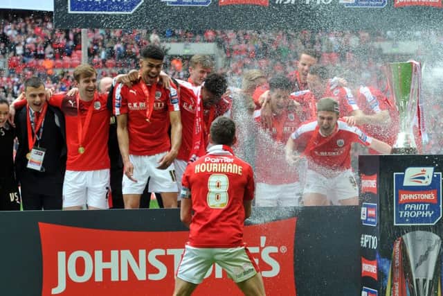 Barnsley's players celebrate winning the Johnstone Paint Trophy Final. Picture: Tony Johnson.