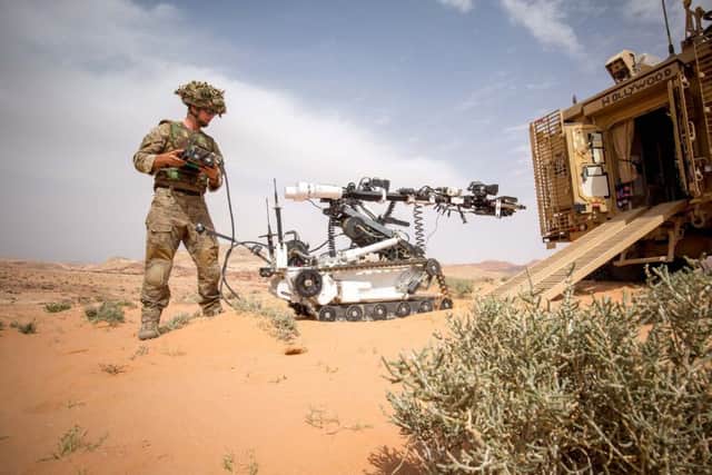 EOD regiments take part in a training exercise using a "wheelbarrow" robot in the Jordanian desert. Picture: SWNS