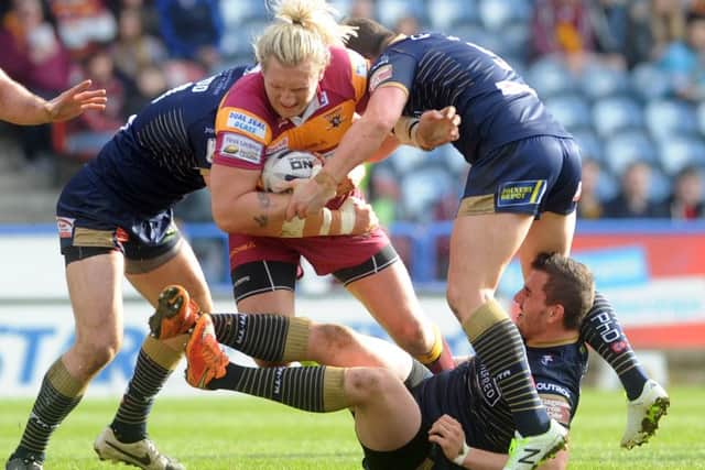 BATTLING: Huddersfield Giants forward Eorl Crabtree showing the determination required to avoid the drop. Picture: Simon Hulme