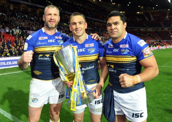 HAPPY ENDING: Kevin Sinfield, centre, with Jamie Peacock, left and Kylie Leuluai after winning last year's Grand Final at Old Trafford.