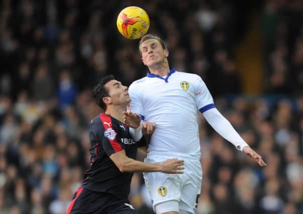 Rotherham United's Stephen Kelly challenges Leeds' Chris Wood