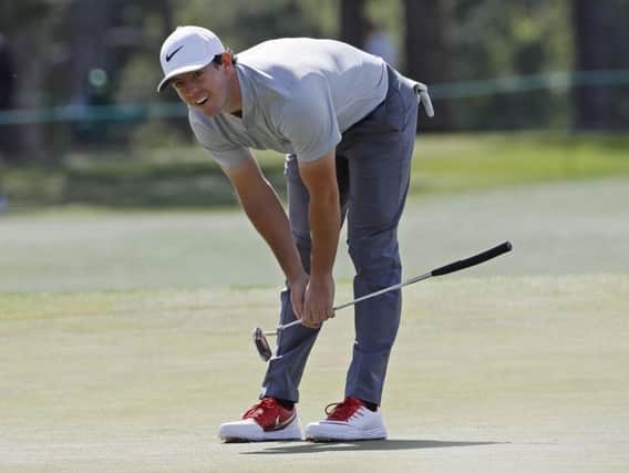 Rory McIlroy reacts after missing a birdie on the 17th green during the second round of the Masters (Picture: David J Phillip/AP).