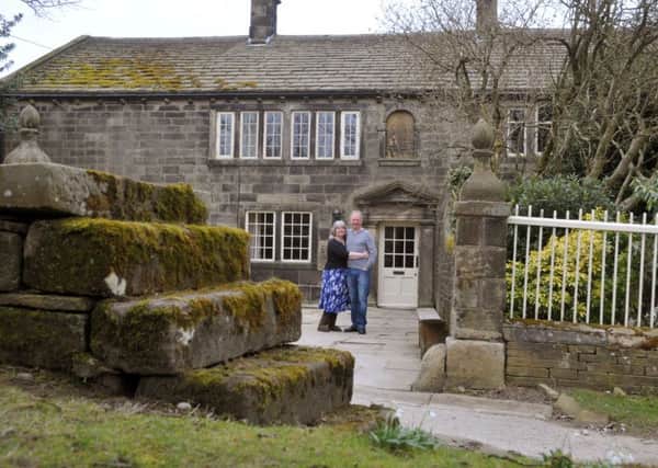 Steve Brown and Julie Akhurst outside Ponden Hall, their home and B&B