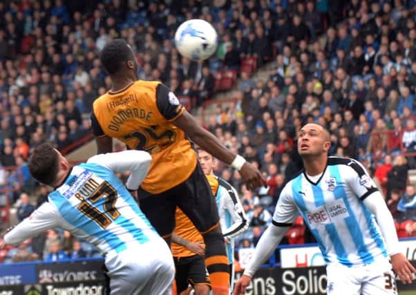 Adama Diomande rises highest to head home Hull Citys stoppage-time leveller.
