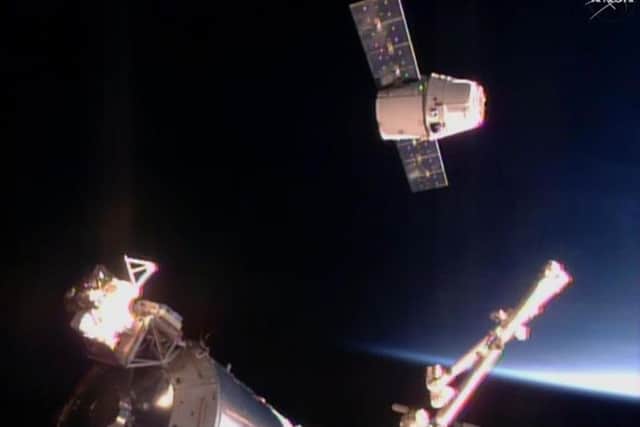A SpaceX Dragon cargo ship arrives at the International Space Station.