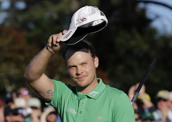 Danny Willett waves to the gallery after putting out on the 18th hole (Picture: David J. Phillip?AP).