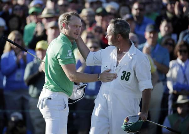 Masters champion Danny Willett is congratulated by fellow Yorkshireman and Lee Westwoods caddie Billy Foster.