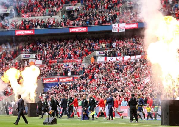 Barnsley and Oxford make their way onto the pitch for the Johnstones Paint Trophy final, which the Reds won 3-2 (Picture: Adam Davy/PA Wire).