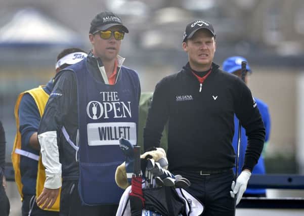 Danny Willett discusses a tee shot with his caddie Jonathan Smart during last year's Open at St Andrews (Picture: Owen Humphreys/PA Wire).