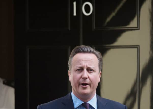 David Cameron leaves 10 Downing Street for Prime Minister's Questions.