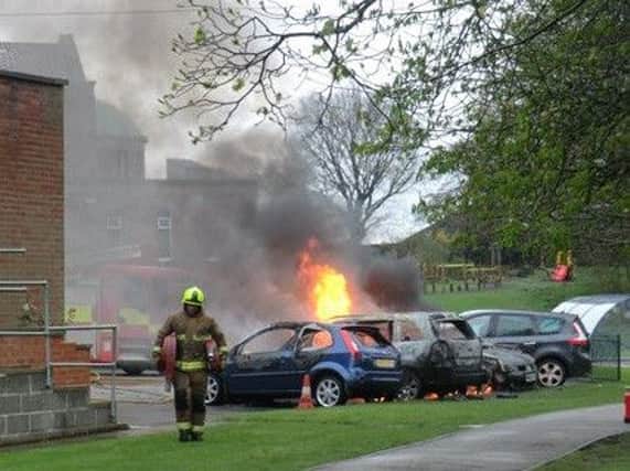 Fire in a car park of the church of Immaculate Heart of Mary RC at Moortown in Leeds. Photo: Michael Crossley.
