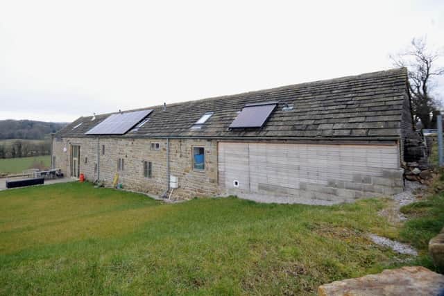 The former cow byre has been gradually "greened" over the last ten years and now boasts a ground source heat pump and solar panels