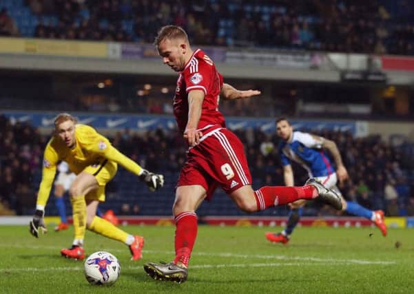 Jordan Rhodes, in action against former club Blackburn Rovers, saved Middlesbrough from defeat against MK Don (Picture: Martin Rickett/PA).