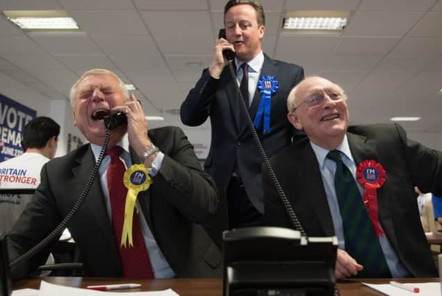 Prime Minister David Cameron helps to campaign for a 'Remain' vote in the forthcoming EU referendum at a phone centre in London along with fellow pro EU campaigners, Lord Ashdown (left) and Lord Kinnock.  PRESS ASSOCIATION Photo. Picture date: Thursday April 14 2016. Photo:  Stefan Rousseau/PA Wire