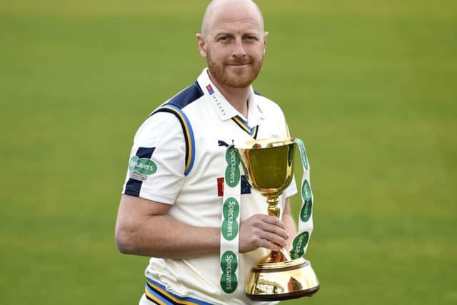 Yorkshire CCC's Andrew Gale holds the County Championship trophy. Picture: PA.