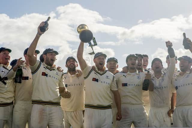 SAM AGAIN PLEASE: Yorkshire's captain Andrew Gale holds the LV County Championship trophy aloft as his team celebreates at Headingley last season.