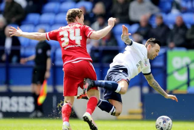 Middlesbrough's Adam Forshaw (left) tackles Bolton Wanderers' Mark Davies.