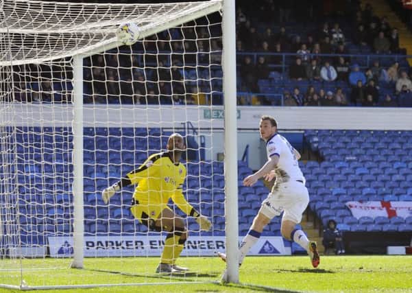 Chris Wood and Ali Al Habsi watch his header hit the top of the net for Leeds' second goal.  Picture Bruce Rollinson