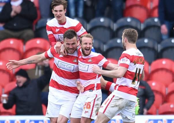 Doncaster Rovers' Andy Butler celebrates scoring his side's second goal.