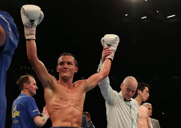 Josh Warrington celebrates his victory over Hisashi Amagasa at the First Direct Arena, Leeds. Picture: Simon Cooper/PA.