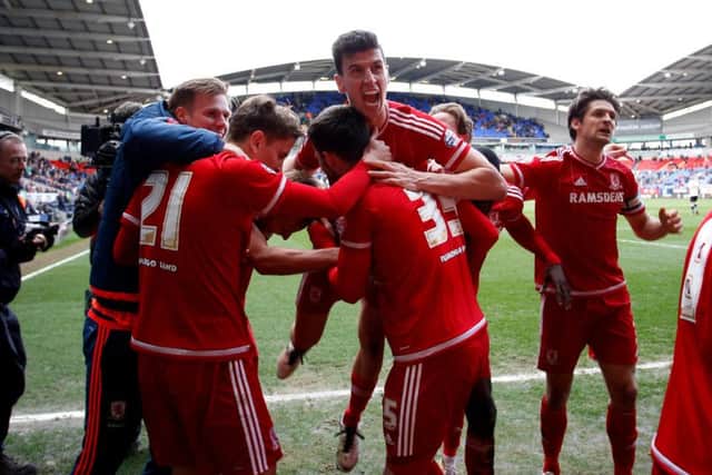 ON THE UP: Middlesbrough's players celebrate Jordan Rhodes's late winner at Bolton. Picture: PA.