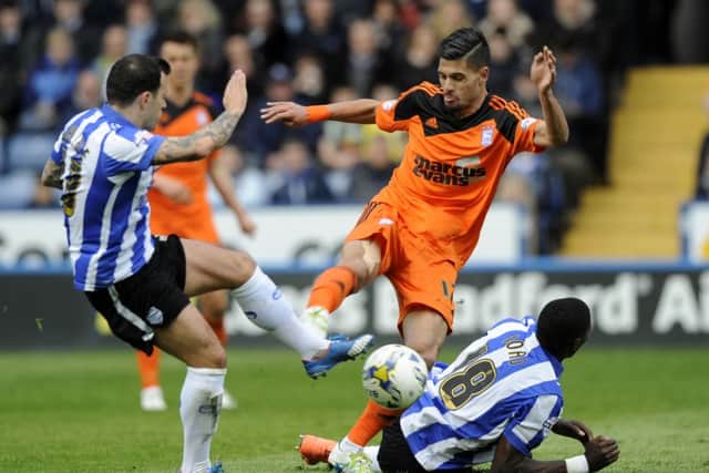 FRUSTRATION: Sheffield Wednesday's Ross Wallace, left, beats Ipswich Town's Jonathan Douglas to the ball, but it was to end 1-1 at Hillsborough. Picture: Steve Ellis.