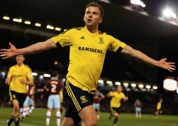 Middlesbrough's Jordan Rhodes celebrates scoring the first goal  during the Sky Bet Championship match at the Turf Moor, Burnley.